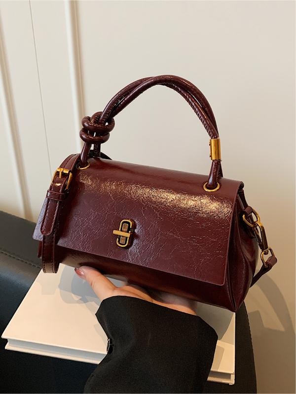 Burgundy leather-look crossbody shoulder bag with gold-tone clasp and top flap