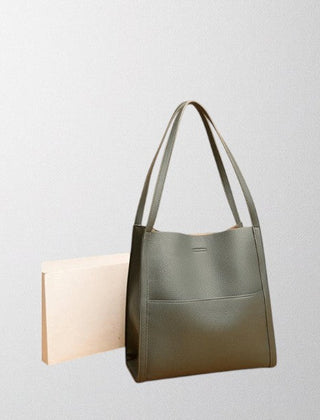Green vegan leather tote bag with two top handles and minimalist front panel