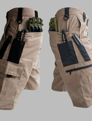 Tan outdoor tactical shorts with tool pouches, zipper pockets, and adjustable waist band