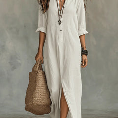 White button-front maxi dress with V-neck, three-quarter sleeves, and side slit
