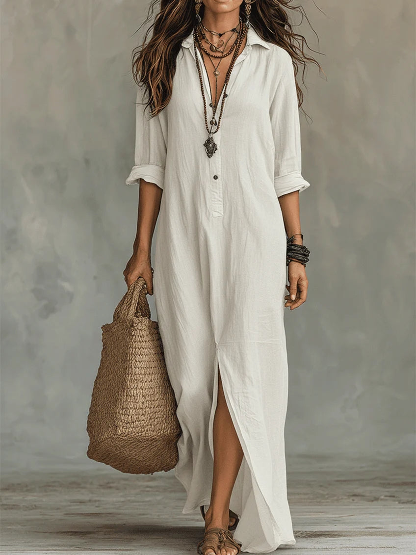 White button-front maxi dress with V-neck, three-quarter sleeves, and side slit