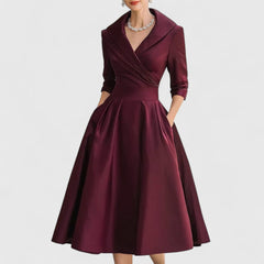 Deep red midi dress with surplice V-neck, three-quarter sleeves, and full gathered skirt