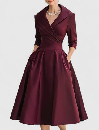 Deep red midi dress with surplice V-neck, three-quarter sleeves, and full gathered skirt