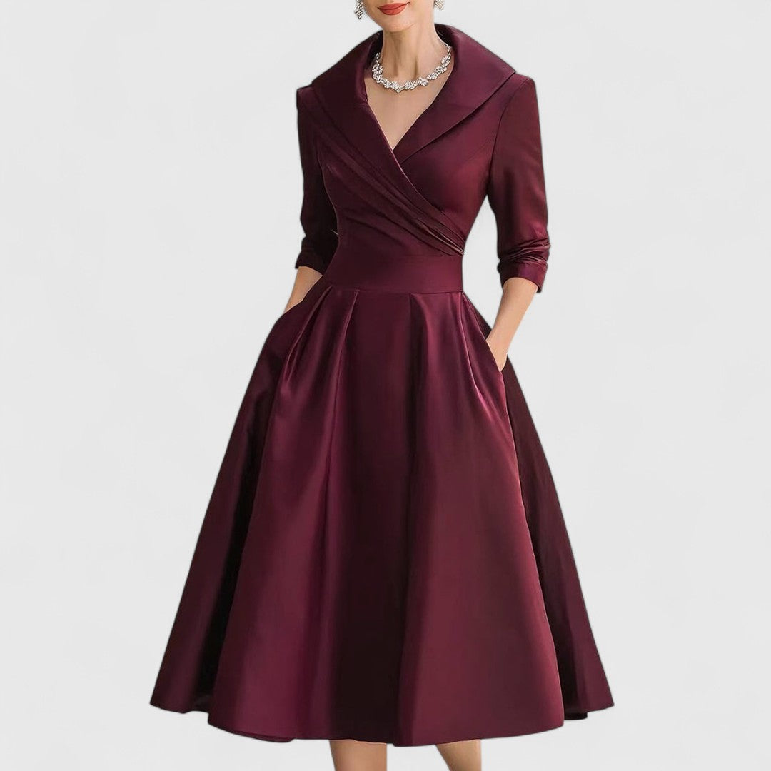 Deep red midi dress with surplice V-neck, three-quarter sleeves, and full gathered skirt