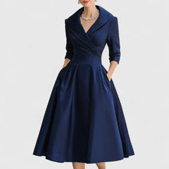 Navy midi dress with surplice V-neck, three-quarter sleeves, and gathered skirt