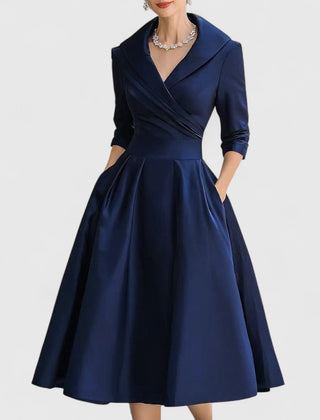 Navy midi dress with surplice V-neck, three-quarter sleeves, and gathered skirt