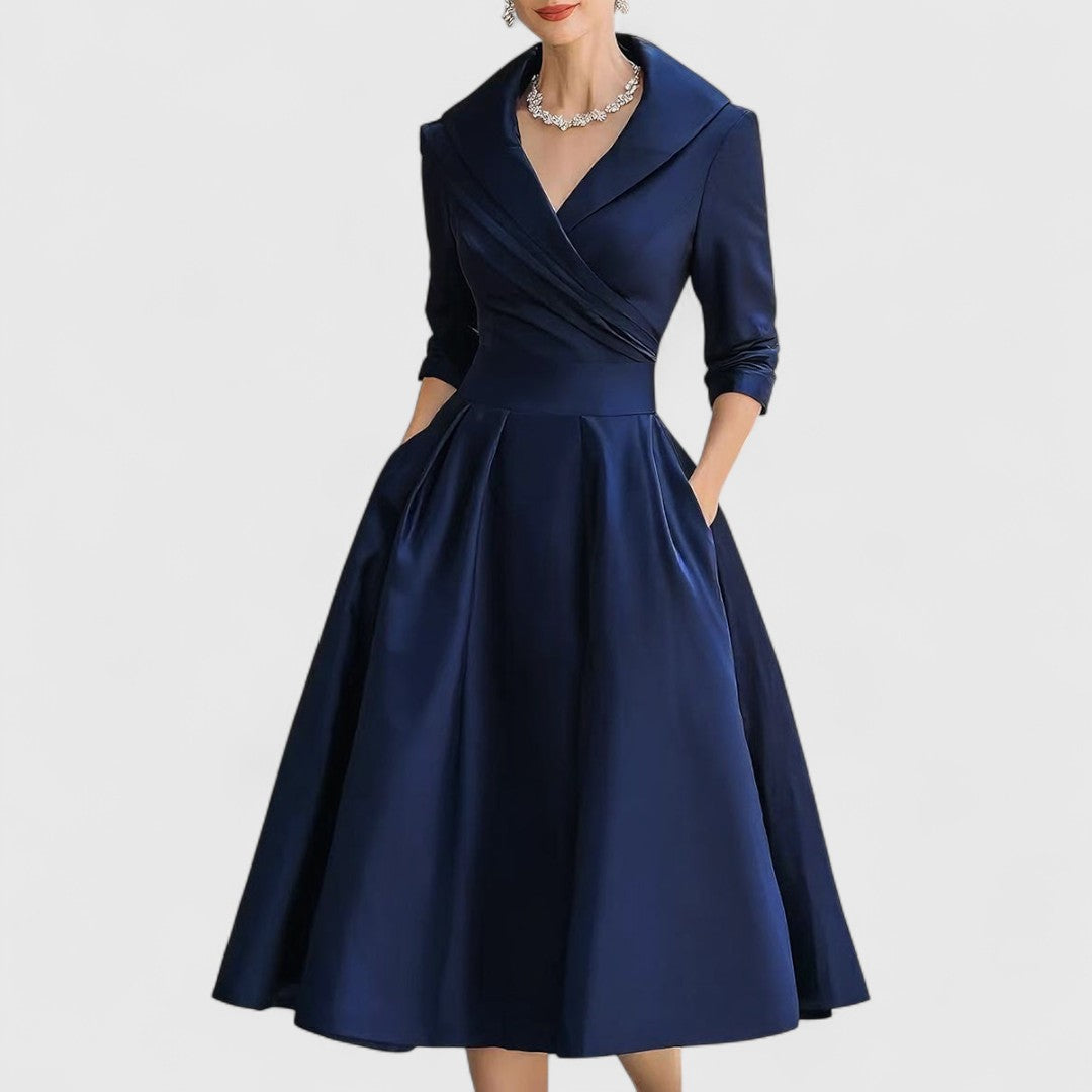 Navy midi dress with surplice V-neck, three-quarter sleeves, and gathered skirt