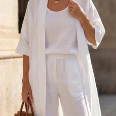 3-piece white set close-up: long tunic over square-neck top with drawstring-waist pants.