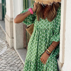 Green patterned maxi dress detail: V-neck, ruched bodice, three-quarter sleeves