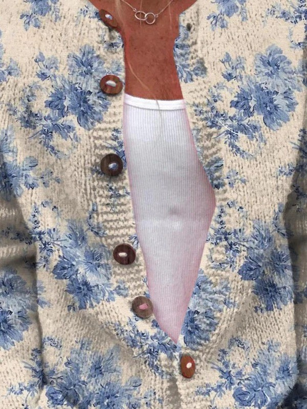 Women’s vintage knit cardigan, cream with blue floral print, long sleeves, brown button front