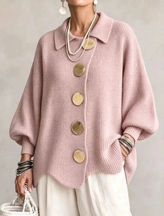Oversized pink collared button cardigan with long balloon sleeves and large round buttons