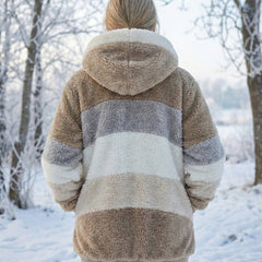 Back view of colourblock plush jacket in tan, cream, and light gray with hood