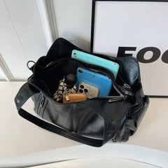 RAE Classic leather handbag, black with open top showing inner compartments and phone pouch