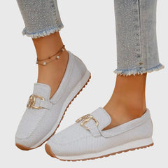 White orthopedic loafer sneakers with gold-tone buckle ornament and treaded sole