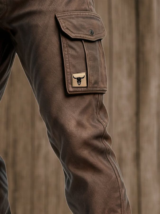Dark brown utility pants close-up of cargo pocket patch and flap
