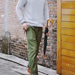 Straight fatigue pants in olive green with cargo pocket detailing and cuffed hems