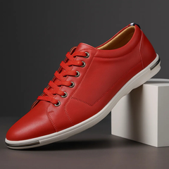 Red leather low-top sneaker with lace-up front and white rubber sole