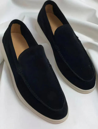 Navy blue suede loafer slip-on with moc stitching and white rubber sole