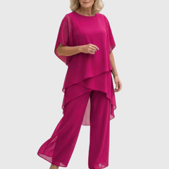 Elara elegant palazzo set in bright magenta: flowing cape-sleeve top and wide-leg pants