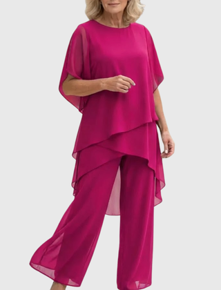 Elara elegant palazzo set in bright magenta: flowing cape-sleeve top and wide-leg pants