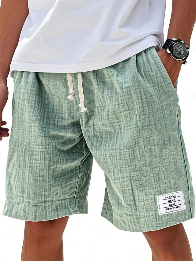 Everyday shorts in green linen-look fabric with drawstring and side slant pockets