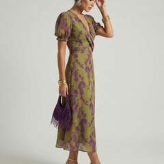 Floral midi wrap dress with short puff sleeves and draped waist, side view
