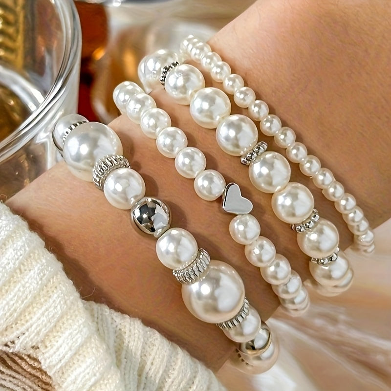 Pearl heart bracelet set close-up with mixed-tone beads, heart charm, and pearl strands