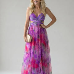 Purple and pink multicolor maxi wrap dress with V-neck, sleeveless bodice, and waist tie.
