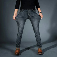 Men's stretch denim jeans, grey-blue slim fit, front seams and tan leather patch