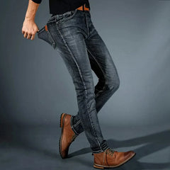 Men's stretch denim jeans, dark blue slim fit, front pocket and stitching visible