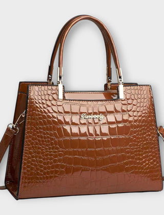 Shiny crocodile-pattern handbag in brown with top handles and crossbody strap