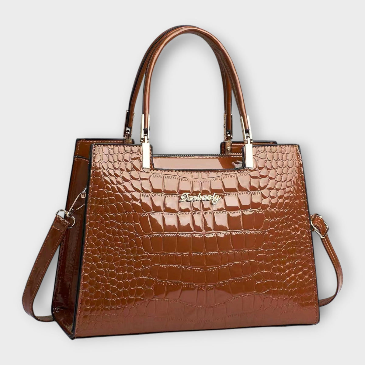 Shiny crocodile-pattern handbag in brown with top handles and crossbody strap