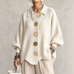 Oversized cream collared button cardigan with long balloon sleeves and large round buttons