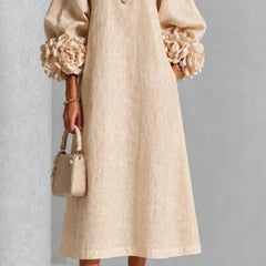 Beige floral midi dress with button front and rose-cuff puff sleeves, front view