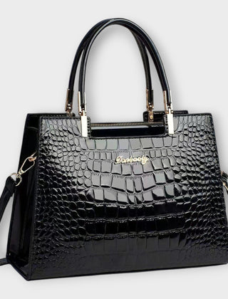 Shiny crocodile-pattern handbag in black with top handles and gold-tone hardware