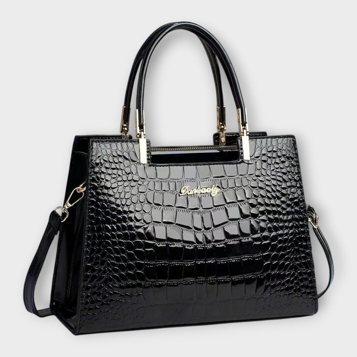 Shiny crocodile-pattern handbag in black with top handles and gold-tone hardware