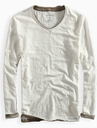 White cotton shirt with V-neck and long sleeves, ribbed cuffs