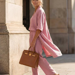 3-piece dusty pink set with long tunic, layered top, and wide-leg trousers.