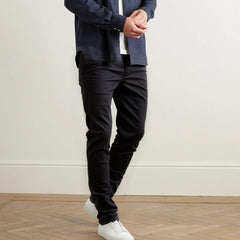Black slim trousers with tapered legs and zip fly, side and back pockets