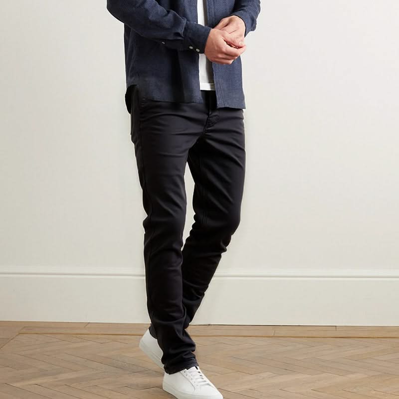 Black slim trousers with tapered legs and zip fly, side and back pockets