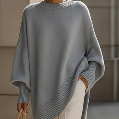 Grey knit jumper sleeve and hem with ribbed trim, drop-shoulder knit