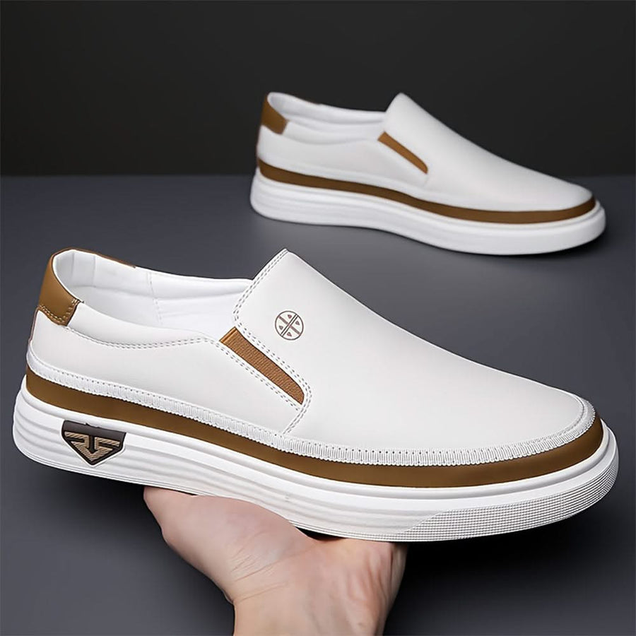 White slip-on shoes with brown collar trim and striped rubber sole