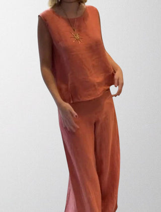 Rust boho two-piece set: sleeveless top and wide-leg pants with necklace