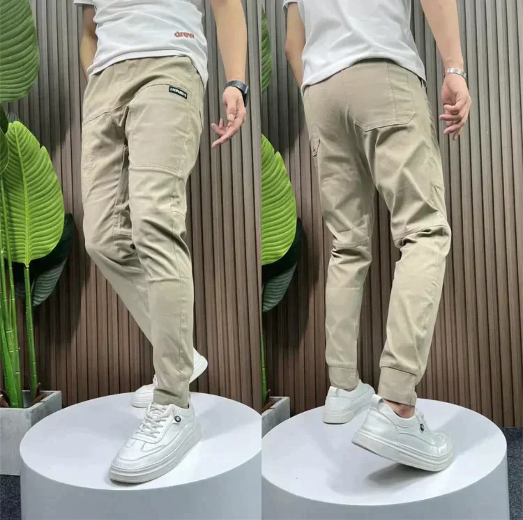 Beige stretch utility pants with cargo pockets and elastic cuffed ankle hem