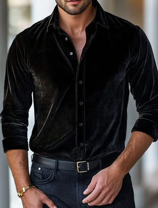 Black velvet button-up shirt with long sleeves and pointed collar.