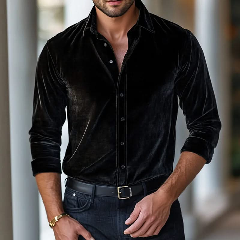 Black velvet button-up shirt with long sleeves and pointed collar.