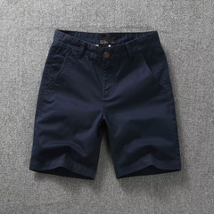 Solid navy tactical flex shorts with belt loops and button fly, side pockets