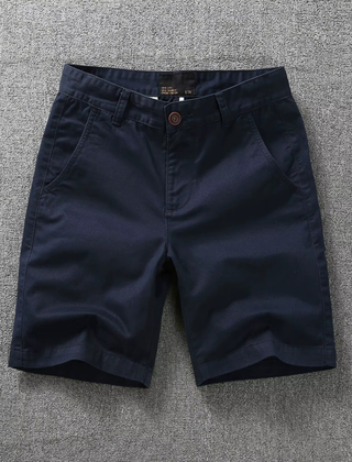 Solid navy tactical flex shorts with belt loops and button fly, side pockets