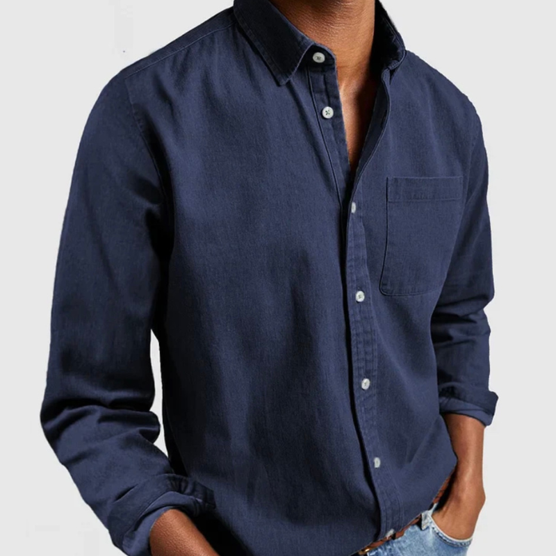 Navy blue denim shirt with long sleeves, button front, and chest pocket