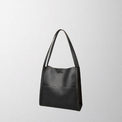 Black vegan leather shoulder bag with top handles and clean, structured front